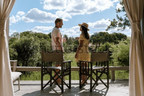 Couple enjoying a morning on their lodge deck